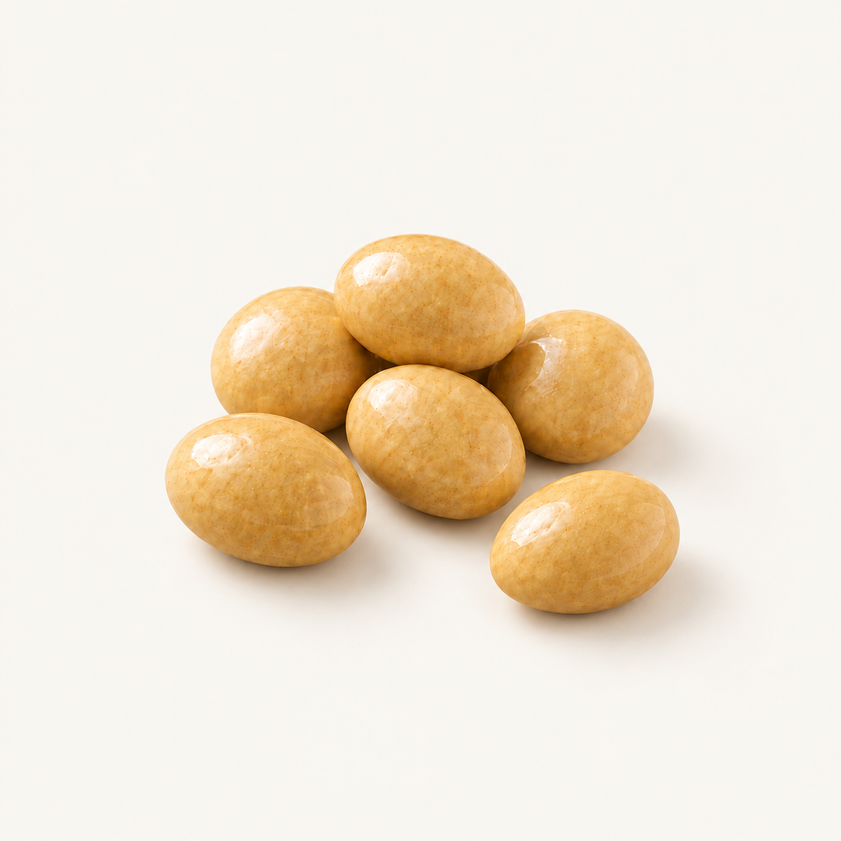 Chai Almonds, styled as a small pile on warm ivory