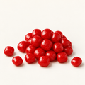 Cherry Sours in a small pile on warm ivory