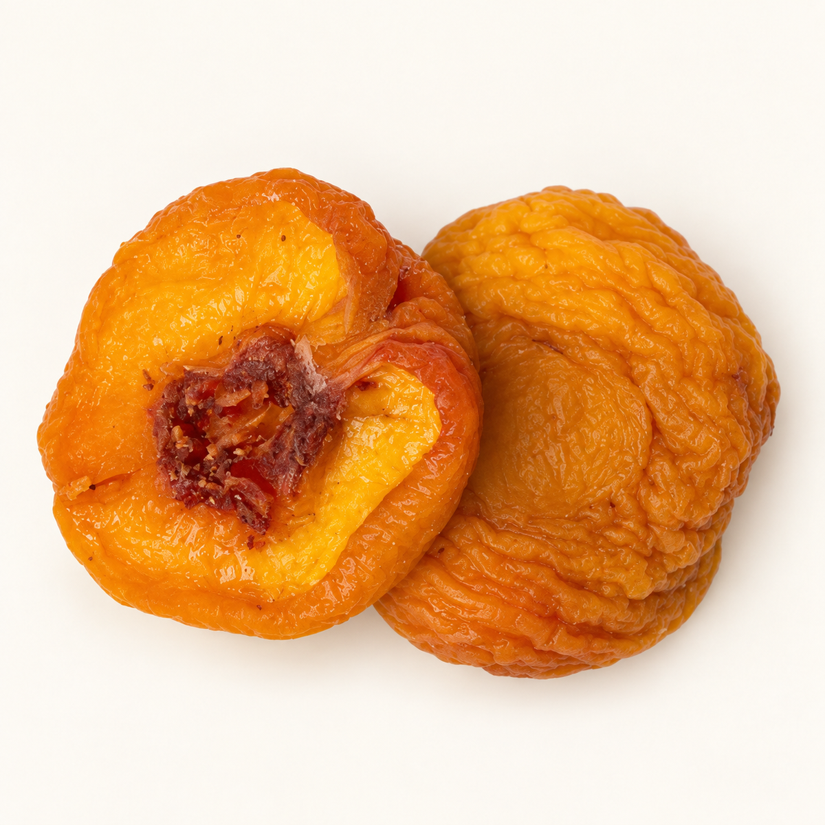 Dried Peaches, styled as a small pile on warm ivory