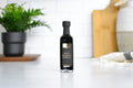 Black & Gold Reserve Balsamic Vinegar in a glass bottle with a black and gold label
