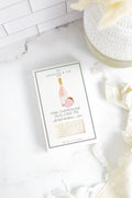 Jocelyn & Co. Pink Champagne Mug Cake Mix box on a pale marble countertop