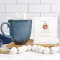 Jocelyn & Co. Pour Over Coffee box beside a blue mug with a pour-over filter, tightly framed on a wooden board