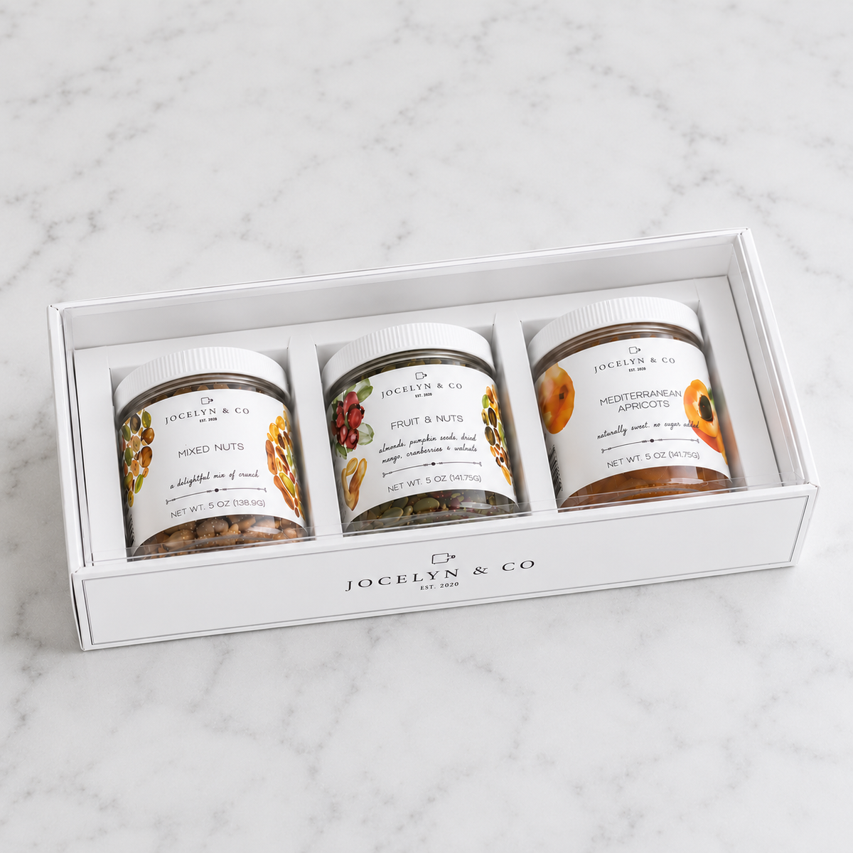 Jocelyn & Co. Mixed Nuts, Fruit & Nuts, and Mediterranean Apricots in a white three-jar rigid gift box