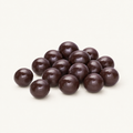 Dark chocolate Blackberry Brandy Cordials in a small pile on warm ivory