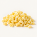 Small diced dried pineapple, styled as a small pile on warm ivory