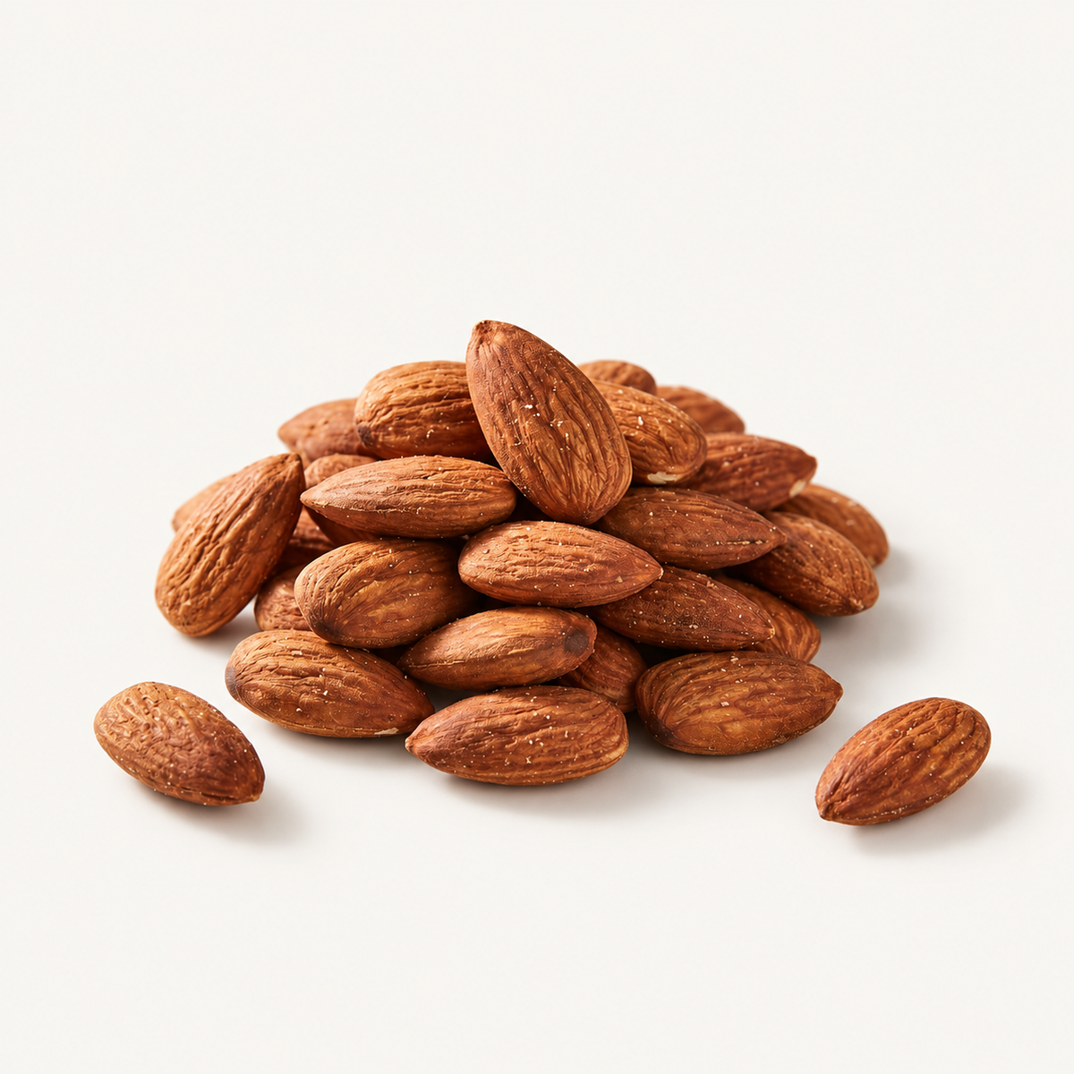 Roasted Almonds, styled as a small pile on warm ivory