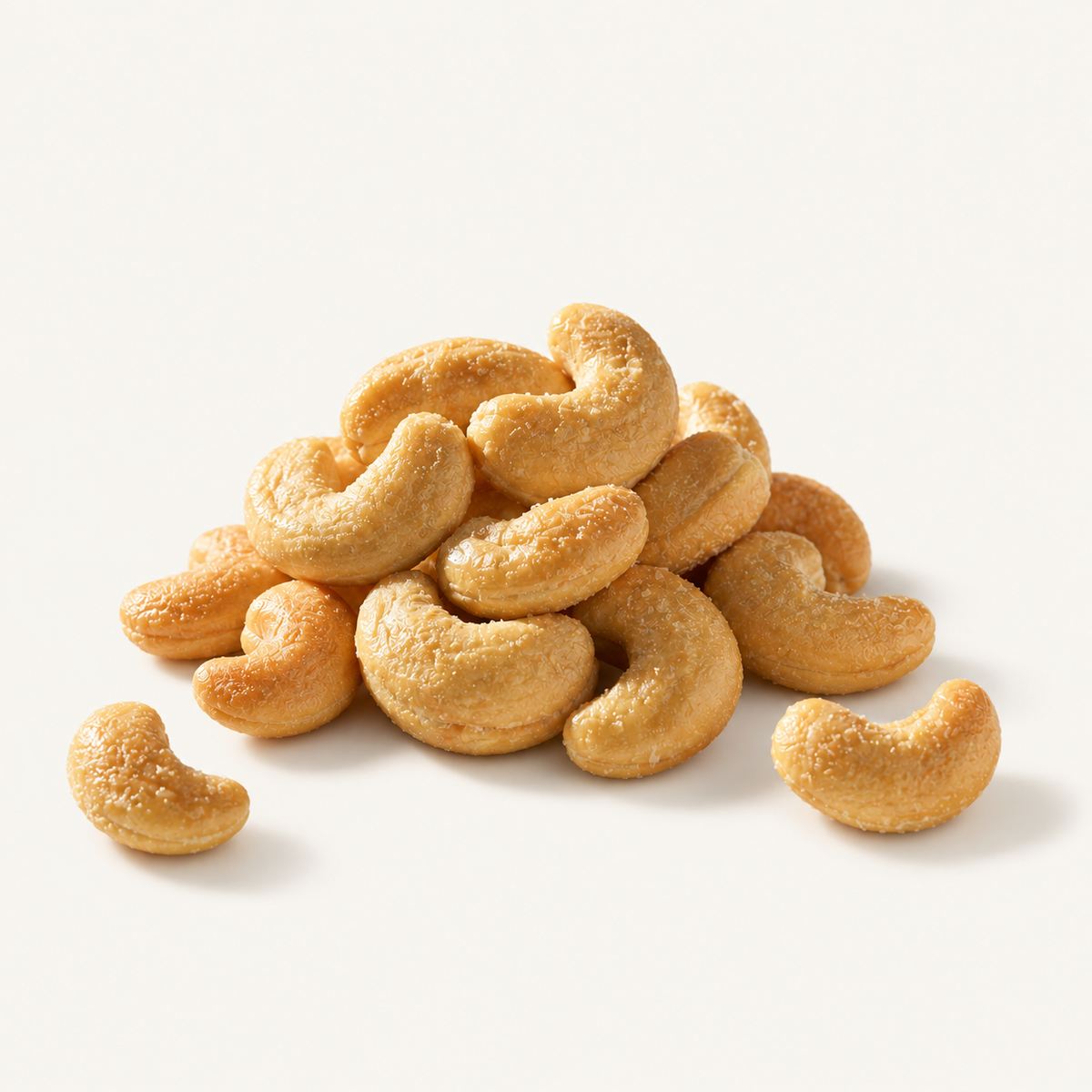 Salted Cashews, styled as a small pile on warm ivory