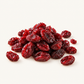Sweetened Cranberries, styled as a small pile on warm ivory